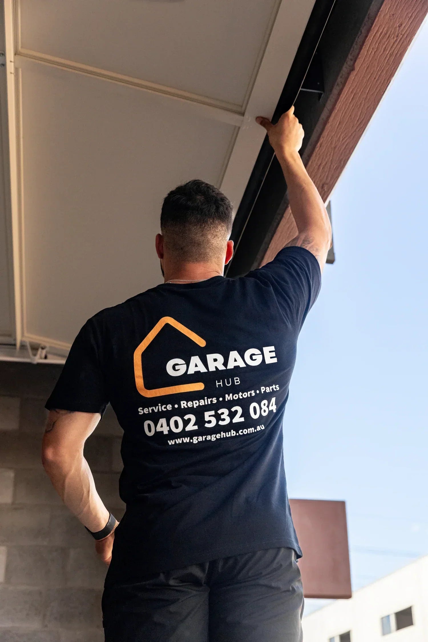 Garage Hub Technician checking integrity of the garage door