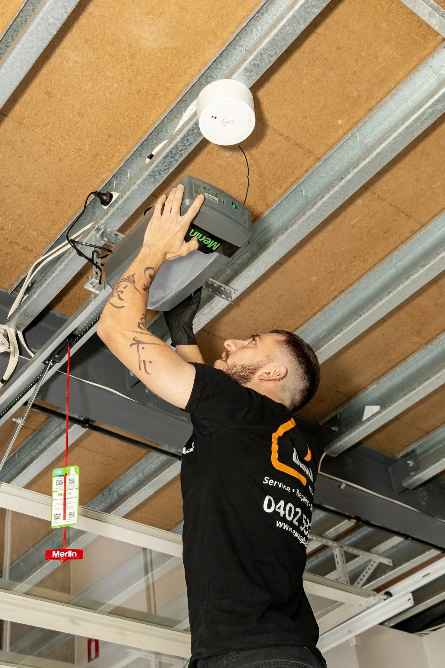Garage Hub Technician installing a Merlin Motor