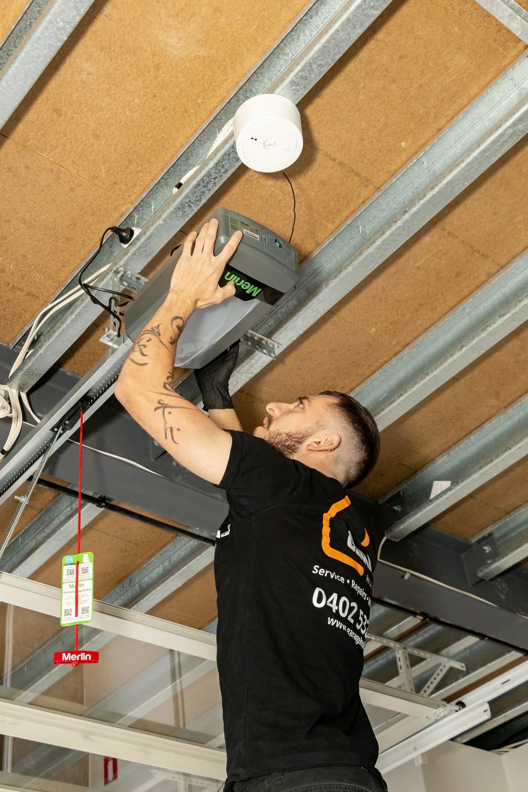 Garage Hub Technician installing a Merlin Motor